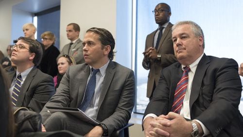 March 16, 2017, Atlanta - WRS Real Estate Investments President and CEO Scott Smith, right, and development officer Kevin Rogers, center, react to the approval of the sale of Underground Atlanta during an Invest Atlanta board meeting in Atlanta, Georgia, on Thursday, March 16, 2017. (DAVID BARNES / SPECIAL)