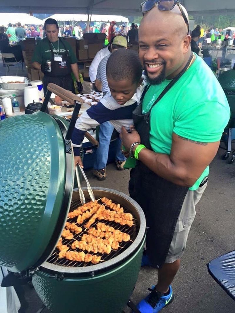 Chef David Rose, a Big Green Egg Ambassador, grilling at an event with his nephew AJ. COURTESY OF CHEF DAVID ROSE