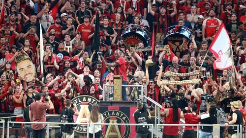 Atlanta United fans fill Mercedes-Benz Stadium as Olympic champion and world heavyweight champion Evander Holyfield hammers the gold spike to start the game against Orlando City during the first half in a MLS soccer match on Saturday, June 30, 2018, in Atlanta.     Curtis Compton/ccompton@ajc.com