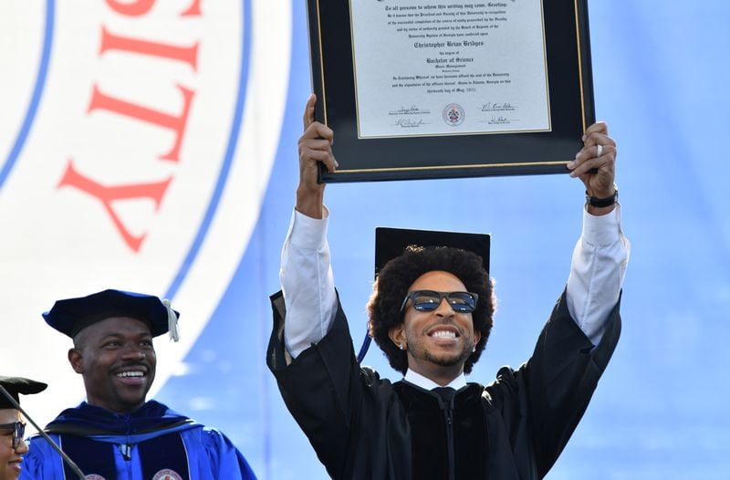 Rapper and actor Chris “Ludacris” Bridges holds up his honorary bachelor’s degree during a commencement ceremony at Center Parc Stadium on Wednesday, May 4, 2022. (Hyosub Shin / Hyosub.Shin@ajc.com)