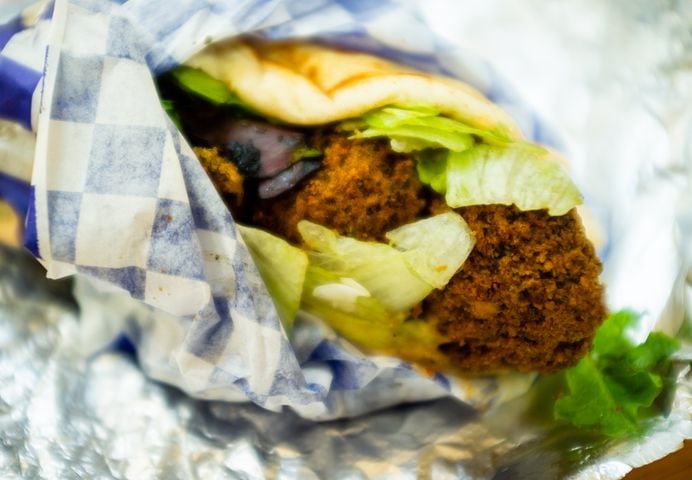 The densely-packed falafel wrap at Grecian Gyro will only cost you $6. CONTRIBUTED BY HENRI HOLLIS