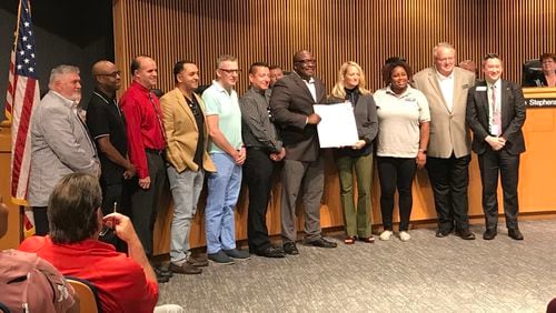 Gwinnett Commissioner Ben Ku (far right) and representatives from Positive Impact Health Center and the Norcross Gay Club pose for a photo following  a proclamation declaring June 2019 as pride month in Gwinnett County. TYLER ESTEP / TYLER.ESTEP@AJC.COM