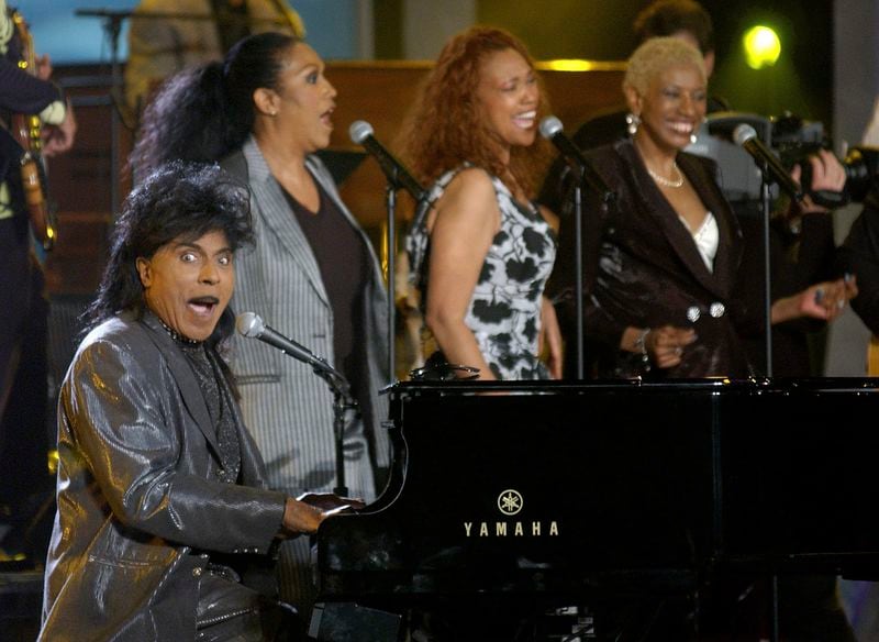 FILE - In this July 22, 2001 file photo, Little Richard performs at the 93rd birthday and 88th year in show business gala celebration for Milton Berle, in Beverly Hills, Calif. Little Richard, the self-proclaimed “architect of rock ‘n’ roll” whose piercing wail, pounding piano and towering pompadour irrevocably altered popular music while introducing black R&B to white America, has died Saturday, May 9, 2020.