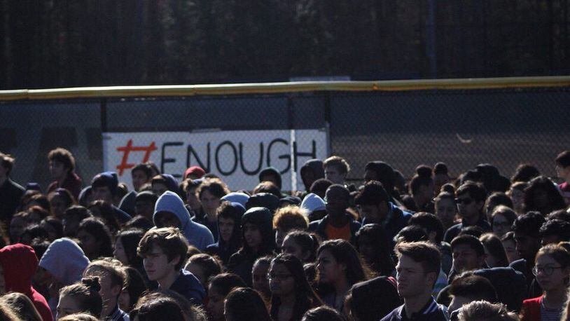 Students gather outside Northview High School in Johns Creek to participate in nationwide school walkouts that took place Wednesday. Fulton County Schools softened its initial stance and allowed students to participate, though district officials still don't call the activity a "walk out."