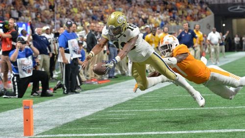 September 4, 2017 Atlanta - Georgia Tech quarterback TaQuon Marshall (16) dives past Tennessee defensive back Rashaan Gaulden (7) for a touchdown in the first half of NCAA college football game at the Mercedes-Benz Stadium on Monday, September 4, 2017. Tennessee won 42-41 over the Georgia Tech in double overtime. HYOSUB SHIN / HSHIN@AJC.COM