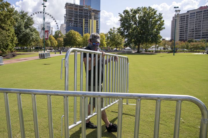 Crew set-up private pods for the Big Night Out concert series at Centennial Olympic Park in downtown Atlanta, on Thursday, October 22, 2020. Rival Entertainment is presenting the series in coordination with the Georgia World Congress Center Authority and will offer Atlanta fans an experience with private pods.  The Big Night Out will commandeer the downtown park with shows by Moon Taxi and Pigeons Playing Ping Pong (Oct. 23), Marcus King Trio and Futurebirds (Oct. 24) and Big Boi and Friends featuring KP the Great (Oct. 25). (Alyssa Pointer / Alyssa.Pointer@ajc.com)