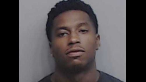 Laron P. Patterson was the first arrested in connection to a July 4 robbery of a Sandy Springs AT&T store. Two others remain at-large.