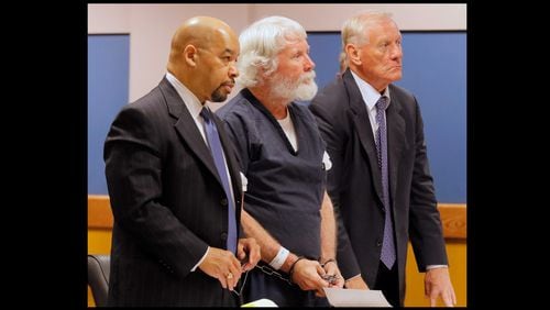 Claud “Tex” McIver stands with his attorneys, William Hill (left) and Steve Maples Friday in Fulton Superior Court in this August 2017 file photo. Both attorneys announced this week they are leaving the case.