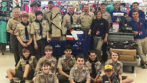 Boy Scout Troop 1109 pose with some of their new camping equipment at Academy Sports + Outdoors in Cumming.