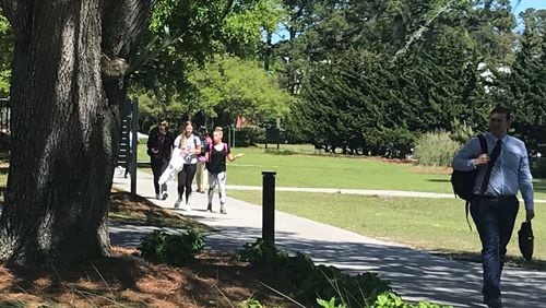 Students walk across the Georgia Southern University campus in Savannah on Tuesday, April 16, 2019. The Georgia Board of Regents held the first of a two-day meeting there to vote on tuition and fees for Georgia Southern and the 25 other schools in the University System of Georgia. ERIC STIRGUS / ESTIRGUS@AJC.COM.