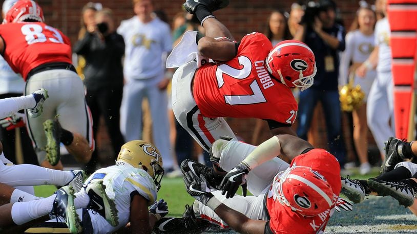 Nick Chubb of the Georgia Bulldogs jumps into the end zone for a touchdown during the first half against the Georgia Tech Yellow Jackets at Bobby Dodd Stadium on November 25, 2017 in Atlanta, Georgia. (Photo by Daniel Shirey/Getty Images)