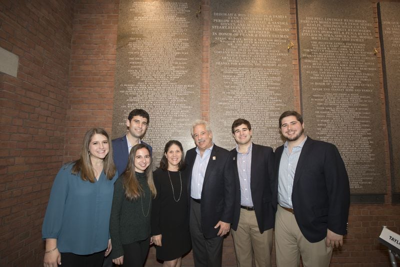 The Edlin family poses at the United States Holocaust Memorial Museum during the dedication of a wall in honor of Lola and Rubin Lansky, who were early supporters of the museum. They are Reanna Edlin (from left), Benjamin Gordon, Felicia Edlin Gordon, Karen Lansky Edlin, Andrew Edlin, Lonnie Edlin and Adam Edlin. Courtesy of the Edlin family