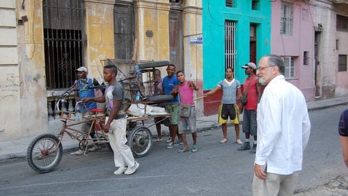 Locals pose for a reporter’s camera in Havana on Tuesday, June 30, 2015. Pictured on far right: World Affairs Council President Charles Shapiro. (KATIE LESLIE / KLESLIE@AJC.COM)