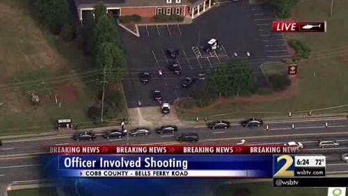 Shots were fired at police officers in a Fidelity Bank parking lot in Cobb County. (Credit: Channel 2 Action News)