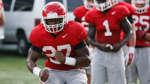 UGA running back Nick Chubb (27) runs a drill during Tuesday's practice. The first-team All-SEC player is considered one of the best players in the nation.