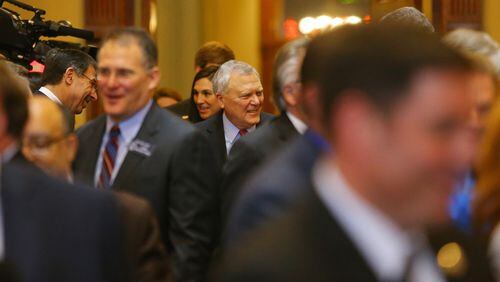 011415 ATLANTA: Governor Nathan Deal follows his escort into the House chambers to deliver the State of the State address to a joint session during legislative day 3 on Wednesday, Jan. 14, 2015, in Atlanta. Curtis Compton / ccompton@ajc.com Gov. Nathan Deal follows his escort into the House chambers to deliver the State of the State address to a joint session on Wednesday. Curtis Compton, ccompton@ajc.com