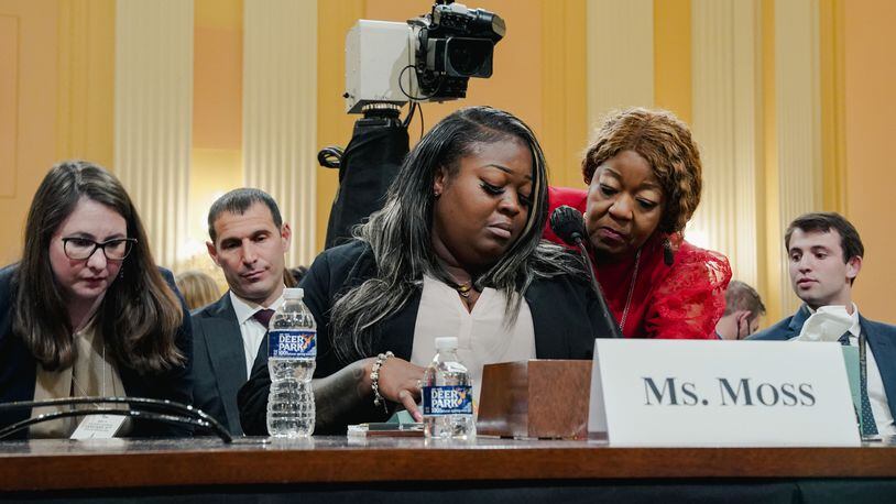 An emotional Wandrea "Shaye" Moss is comforted by her mother, Ruby Freeman, during their testimony in June before a House select committee investigating the Jan. 6, 2021, attack on the U.S. Capitol. (Shuran Huang/The New York Times)