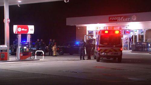 A  Fulton County police officer shot at a man wielding a machete, police said.