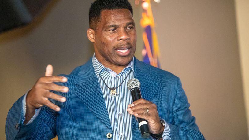 Republican U.S. Senate hopeful Herschel Walker was hit this week by both a story alleging he paid for a girlfriend's abortion in 2009 and tweets from his son saying he had to flee from his father out of fear of violence. (Jenni Girtman for The Atlanta Journal-Constitution)