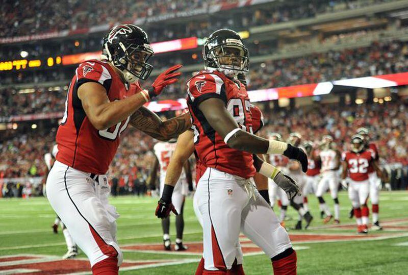 Atlanta Falcons wide receiver Harry Douglas (83) is celebrated by Atlanta Falcons tight end Levine Toilolo (80) after he scored a touchdown against the Tampa Bay Buccaneers in the first half during the first half in their NFL football game on Thursday, September 18, 2014. HYOSUB SHIN / HSHIN@AJC.COM