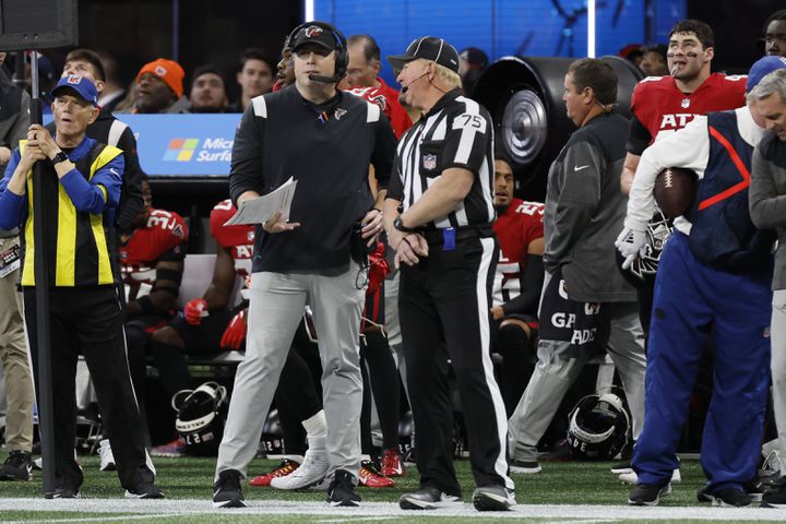 Falcons coach Arthur Smith discusses a call with an official during the third quarter Sunday in Atlanta. (Miguel Martinez / miguel.martinezjimenez@ajc.com)