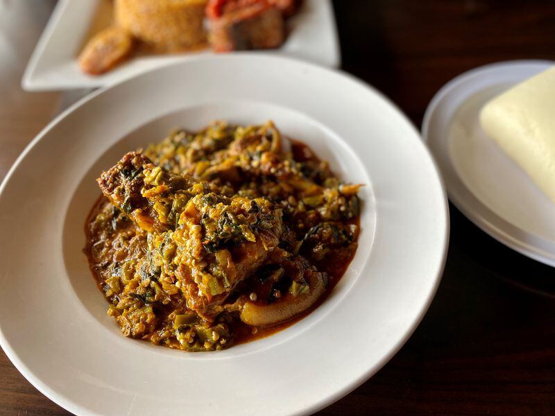 The Island Grill serves Nigerian classics, such as this okra stew with pounded yam. Wendell Brock for The Atlanta Journal-Constitution