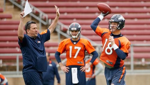 Peyton Manning (18) of the Denver Broncos work with quarterback coach Greg Knapp during the Broncos practice for Super Bowl 50 at Stanford University on February 3, 2016 in Stanford, California. The Broncos will play the Carolina Panthers in Super Bowl 50 on February 7, 2016.  (Photo by Ezra Shaw/Getty Images)