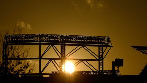 The sun rises over Turner Field after a night of unsettled weather across the South, on Monday, Nov. 24, 2014, in Atlanta.