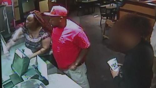 Clayton County police are searching for a woman caught on video throwing food and hitting a cash register at a Zaxby's. (Credit: Channel 2 Action News)