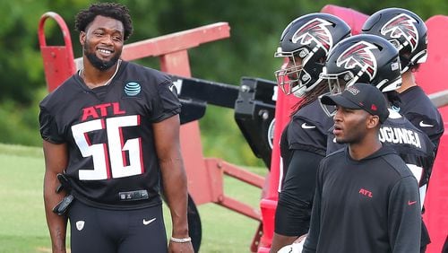 Falcons linebacker Dante Fowler (56) shares a laugh with teammates during team practice at minicamp Wednesday, June 10, 2021, in Flowery Branch. (Curtis Compton / Curtis.Compton@ajc.com)