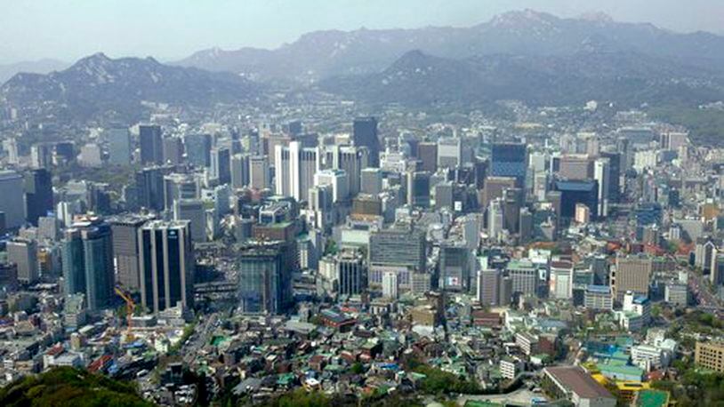 A city view is seen from the observation deck of Seoul Tower, South Korea. With the South Korean currency, called the won, down against the dollar, now's the time to wander the grounds of 600-year-old palaces, meditate in Buddhist temples and trawl cafes and markets in the labyrinthine capital city, Seoul.