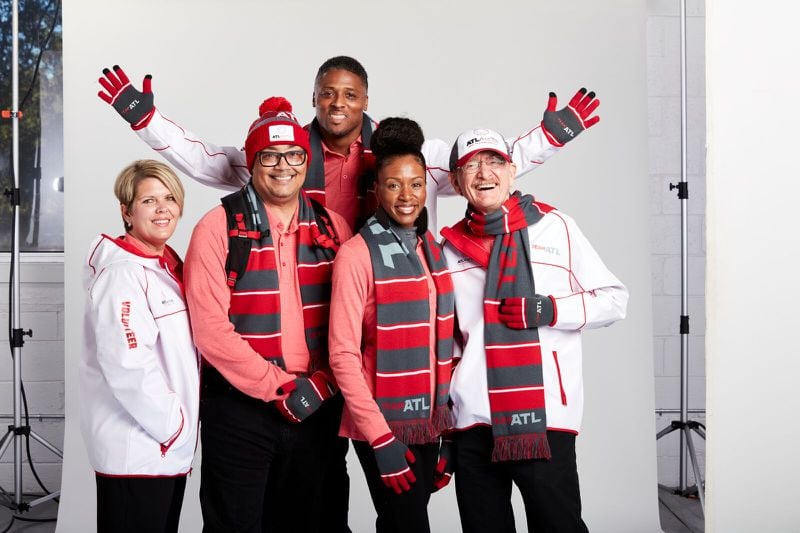 Here’s a look at what 10,000 Super Bowl volunteers will wear.  Former Falcons star Warrick Dunn (back) is honorary captain of the team of volunteers, dubbed Team ATL.