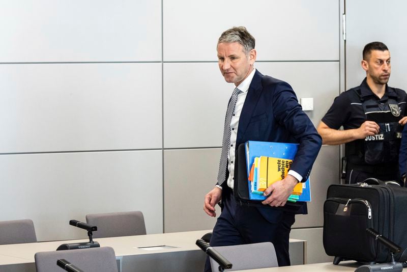 German far-right politician of the Alternative for Germany (AfD) Björn Höcke arrives for a session of his trial over the alleged use of Nazi phrases, at the regional court in Halle, eastern Germany, on Tuesday, April 23, 2024. Höecke, one of the most prominent figures in the far-right Alternative for Germany party, went on trial last Thursday on charges of using a Nazi slogan, months before a regional election in which he plans to run to become his state's governor. (Jens Schlueter/Pool Photo via AP)