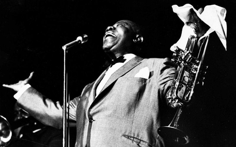 Jazz great Louis Armstrong gestures to the crowd at the Atlanta Jazz Festival on June 6, 1966. AP FILE PHOTO