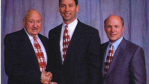 Perry McGuire with the late Truett Cathy, left, and Dan Cathy. Photo: Courtesy of Chick-fil-A