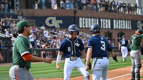 Tim Borden (No. 8) and Tres Gonzalez (No. 3) celebrate at home plate after scoring in the fourth inning of Georgia Tech's 7-5 win over No. 3 Miami April 30, 2022 at Russ Chandler Stadium. (Danny Karnik/Georgia Tech Athletics)