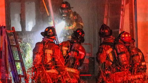 Crews extinguished a blaze that damaged the first floor of a home Friday in northeast Atlanta. JOHN SPINK / JSPINK@AJC.COM