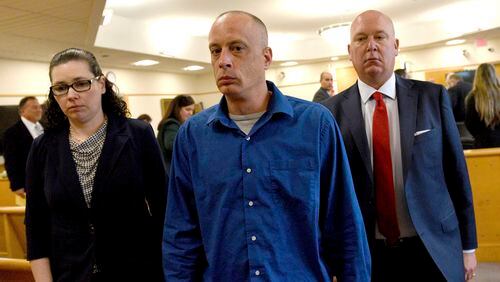 Plaintiff David Meehan, center, leaves the courtroom with his attorney Rus Rilee, right, and victim specialist Joelle Wiggin during Meehan's trial at Rockingham Superior Court in Brentwood, N.H., April 10, 2024. The jury found the state liable for abuse at its youth detention center and awarded the sum to Meehan, a former resident who says he was beaten and raped as a teen. (David Lane/Pool Photo via AP)