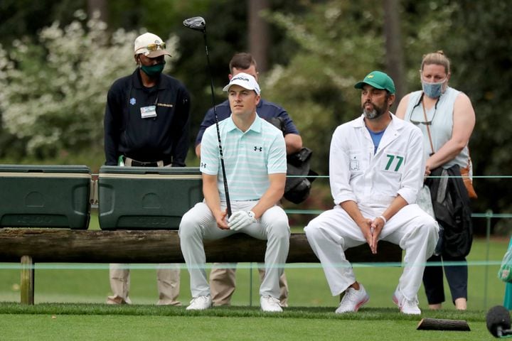 April 10, 2021, Augusta: Jordan Spieth and his caddie Michael Greller wait to tee off on the ninth tee as play prepares to resume during the third round of the Masters at Augusta National Golf Club on Saturday, April 10, 2021, in Augusta. Curtis Compton/ccompton@ajc.com