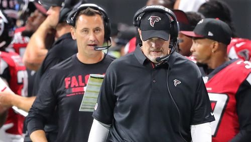 Falcons head coach Dan Quinn and offensive coordinator Steve Sarkisian walk the sidelines during the fourth quarter against the Jaguars in a NFL preseason football game on Thursday, August 31, 2017, in Atlanta.    Curtis Compton/ccompton@ajc.com