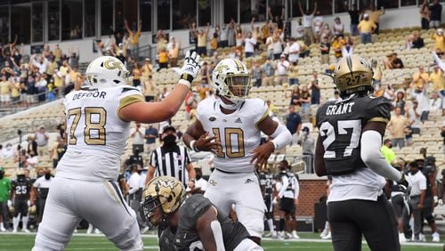 September 19, 2020 Atlanta - Georgia Tech's quarterback Jeff Sims (10) celebrates after he scored a touchdown during the first half of an NCAA college football game at Georgia Tech's Bobby Dodd Stadium in Atlanta on Saturday, September 19, 2020. (Hyosub Shin / Hyosub.Shin@ajc.com)