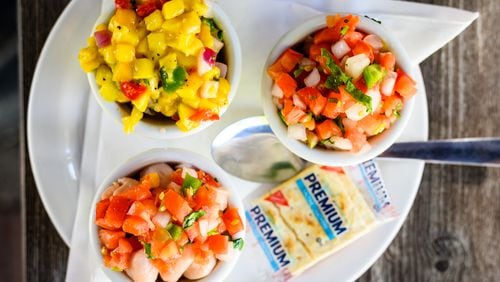 The Ceviche First Timer includes a choice of three types of marinated seafood; clockwise from top: mahi, tuna and scallop.