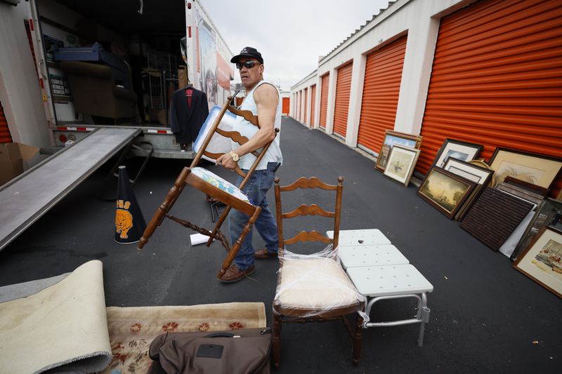 Santiago Murat, a former homeless person at The Hill, is seen moving furniture from a storage unit to a truck on February. 20, 2023. Now, Murat lives in his apartment, and he likes volunteering with The Elizabeth Foundation, which helped get him from living on the streets to his new home.
Miguel Martinez /miguel.martinezjimenez@ajc.com