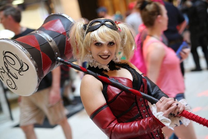 The big colorful hammer, the pigtails, the mischievous smile, let us know that this is Harley Quinn. A cosplay participant in the Dragon Con Parade dresses up as the DC comics character. CONTRIBUTED: DRAGON CON