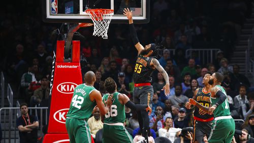 Hawks forward DeAndre' Bembry (95) goes up for the shot in the first half of an NBA basketball game against the Boston Celtics on Saturday, Jan. 19, 2019, in Atlanta. (AP Photo/Todd Kirkland)