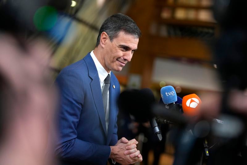 Spain's Prime Minister Pedro Sanchez speaks with the media as he arrives for an EU summit in Brussels, Wednesday, April 17, 2024. European leaders' discussions at a summit in Brussels were set to focus on the bloc's competitiveness in the face of increased competition from the United States and China. Tensions in the Middle East and the ongoing war between Russia and Ukraine decided otherwise and the 27 leaders will dedicate Wednesday evening talks to foreign affairs. (AP Photo/Virginia Mayo)