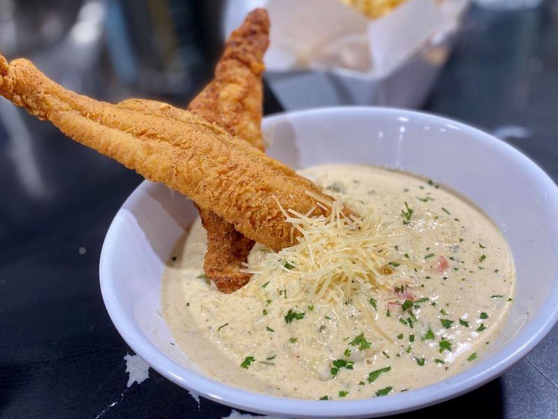 Hippin Hops’ fried catfish with cheese grits will fill you up. (Wendell Brock for The Atlanta Journal-Constitution)