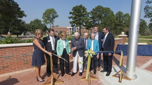 At Friday’s ribbon-cutting for Georgia Southwestern State University’s “Presidential Plaza” Friday are, from left: Kristi Weaver, Georgia Southwestern State University President Neal Weaver, Rosalynn Carter, Jimmy Carter, David Fite, Margaret Fite (granddaughter of former GSW President Peyton Jacob, 1934-1948), Peyton James Fite (great-great-grandson of Peyton Jacob) and Mark Fite (great-grandson of Peyton Jacob). Chris Fenn/Georgia Southwestern State University