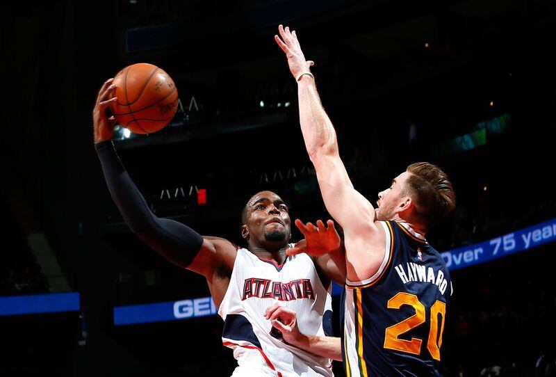 ATLANTA, GA - NOVEMBER 12: Paul Millsap #4 of the Atlanta Hawks drives against Gordon Hayward #20 of the Utah Jazz at Philips Arena on November 12, 2014 in Atlanta, Georgia. NOTE TO USER: User expressly acknowledges and agrees that, by downloading and or using this photograph, User is consenting to the terms and conditions of the Getty Images License Agreement. (Photo by Kevin C. Cox/Getty Images)