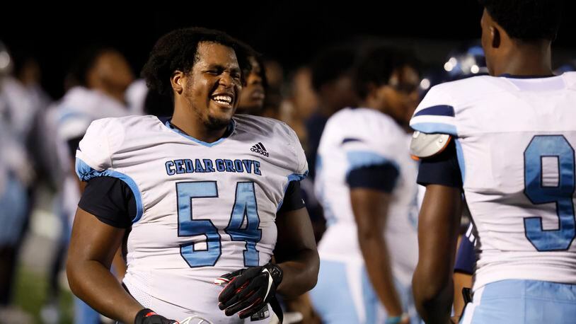 Cedar Grove defensive tackle Kyle Mosley (54) celebrates with teammates during their game against Collins Hill at Collins Hill High School, Friday, September 9, 2022, in Suwanee. Cedar Grove won 40-6. (Jason Getz / Jason.Getz@ajc.com)